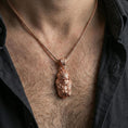 Load image into Gallery viewer, Rose gold plated Viking warrior head pendant necklace worn on the neck, lifestyle wear shot with elegant rosy shine and crisp helmet-and-beard detailing visible.