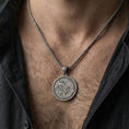 Load image into Gallery viewer, Oxidized Urnes style Viking beast pendant necklace worn on the neck, lifestyle framing showing realistic scale and bold vintage contrast against the chest.