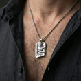 Load image into Gallery viewer, Polished silver Thor pendant necklace worn on the neck, clean lifestyle wear shot capturing bright shine and the detailed Norse god-and-hammer relief in natural light.