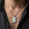Load image into Gallery viewer, Polished silver Norse moon god pendant necklace worn on the neck, clean lifestyle wear shot capturing bright shine and the detailed deity-and-rune relief in natural light.