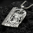 Load image into Gallery viewer, Polished silver Norse moon god pendant necklace on textured volcanic rock, crisp macro product photo emphasizing clean edges, sharp sculpted armor detail, and bright reflective highlights on the figure and runes.