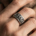 Load image into Gallery viewer, Oxidized koi fish band ring worn on a finger, lifestyle framing showing realistic scale and bold vintage contrast in a natural hand pose.