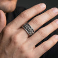 Load image into Gallery viewer, Oxidized skull cuff ring worn on a finger, lifestyle framing showing realistic scale and bold vintage contrast in a natural hand pose.