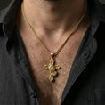 Load image into Gallery viewer, Gold plated praying hands cross pendant necklace worn on neck, lifestyle image emphasizing the bright reflective finish and iconic religious symbolism