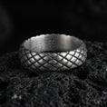 Load image into Gallery viewer, Oxidized woven texture band ring on volcanic stone, macro close-up showing darkened grooves and raised basketweave pattern depth.
