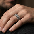 Load image into Gallery viewer, Oxidized sterling silver Japanese dragon band ring worn on the finger, lifestyle photo focusing on bold contrast, textured scales, and statement biker styling.