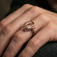 Load image into Gallery viewer, Rose gold plated koi fish wrap ring worn on the finger, lifestyle image showcasing warm rose tone, intricate wrap detailing, and elegant statement look.