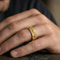 Load image into Gallery viewer, Gold plated floral engraved band ring worn on the finger, lifestyle wear shot emphasizing luxurious gold tone, floral texture, and gift-ready statement look.