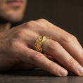 Load image into Gallery viewer, Gold plated koi fish band ring worn on the finger, lifestyle photo emphasizing luxury gold warmth, koi symbolism of perseverance, and gift-ready look.