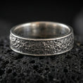 Load image into Gallery viewer, Oxidized sterling silver bark texture band ring on volcanic stone, macro close-up highlighting rugged tree-bark relief and deep shadowed contrast.