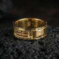 Load image into Gallery viewer, Gold plated sci-fi band ring on volcanic stone, premium macro shot capturing warm gold tone across the futuristic panels and high-relief detailing.