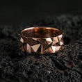 Load image into Gallery viewer, Rose gold plated faceted geometric band ring on volcanic stone, refined macro close-up capturing soft rose warmth, sharp geometry, and premium dimensional highlights.