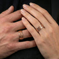 Load image into Gallery viewer, Sterling silver Celtic knot band ring worn on a finger, rose gold plated look with refined warmth and distinct knotwork relief for everyday styling.