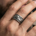 Load image into Gallery viewer, Koi fish spinner band ring worn on a finger, oxidized sterling silver finish making the koi scales and waves stand out boldly.