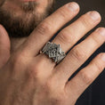 Load image into Gallery viewer, Oxidized Masonic square and compass ring worn on a finger, lifestyle close-up showing bold signet profile and vintage patina look