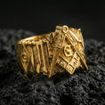 Load image into Gallery viewer, Gold plated Masonic signet ring with square, compass and “G” on volcanic rock, premium macro shot with sharp relief and contrast