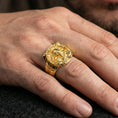 Load image into Gallery viewer, Gold plated Viking warrior signet ring worn on a finger, lifestyle image emphasizing bright plating tone and bold Scandinavian battle symbolism