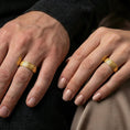 Load image into Gallery viewer, Gold plated geometric pattern band worn on finger, interlocking motif detail, premium lifestyle jewelry photo.