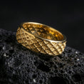 Load image into Gallery viewer, Gold plated geometric lattice band ring on volcanic rock, detailed diamond grid engraving with bold depth, luxury jewelry product photography.