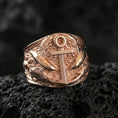 Load image into Gallery viewer, Rose gold plated nautical anchor ring with shark motif and textured ocean background, macro product shot on volcanic rock surface