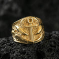 Load image into Gallery viewer, Gold plated anchor statement ring with shark accents and marine-inspired detailing, product-only macro image on black volcanic rock