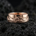 Load image into Gallery viewer, Rose gold plated sterling silver mountain scene ring on volcanic stone, sculpted mountain relief with strong contrast, minimal high-end close-up.