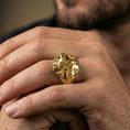 Load image into Gallery viewer, Gold plated compass ring worn on a finger, close-up lifestyle image showcasing the navigation star centerpiece and bold compass points