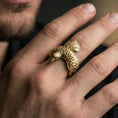 Load image into Gallery viewer, Gold plated eagle wing open ring worn on a finger, close-up lifestyle image showing raised feather detail and raptor head tip