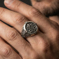Load image into Gallery viewer, Oxidized Saint Peter Keys of Heaven signet ring worn on a finger, close-up lifestyle shot highlighting the engraved key emblem