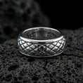Load image into Gallery viewer, Polished silver diamond quilt texture band ring on black volcanic stone, crisp raised grid pattern with smooth comfort edges, centered close-up studio lighting.