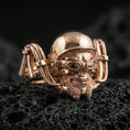 Load image into Gallery viewer, Rose gold plated sterling silver gothic biker skull ring on volcanic stone, sculpted helmeted skull relief with deep contrast and beard detail, minimal high-end close-up.