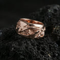 Load image into Gallery viewer, Rose gold plated sterling silver roots band on volcanic stone, sculpted vine and root relief with deep contrast, minimal high-end close-up.