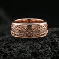 Load image into Gallery viewer, Rose gold plated sterling silver elven star spinner ring on volcanic stone, ornate knotwork engraving with central star detail and deep contrast, minimal high-end close-up.