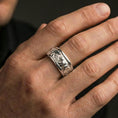 Load image into Gallery viewer, Polished silver bear engraved band ring on finger, crisp bear relief scene and textured background, refined everyday wear close-up.