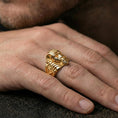 Load image into Gallery viewer, Sterling silver undead pharaoh ring worn on a finger, close-up lifestyle photo showcasing the gold plated finish and engraved side symbol details