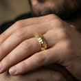 Load image into Gallery viewer, Gold plated dragon scale texture band worn on finger, detailed segmented ridge pattern, premium lifestyle jewelry photo.