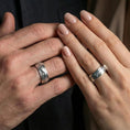 Load image into Gallery viewer, Polished silver nature tree roots band ring on finger, crisp branch relief with leaf detail, refined everyday wear close-up.