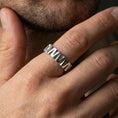 Load image into Gallery viewer, Polished silver geometric wedge band ring on finger, crisp angular facets and brushed finish, natural everyday wear photo.