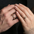Load image into Gallery viewer, Rose gold plated hammered texture ring worn on finger, warm sheen with sculpted rock relief, refined lifestyle close-up.