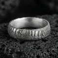 Load image into Gallery viewer, Oxidized sterling silver serpent skin band ring on black volcanic stone, scaled texture with deep shadowed recesses for a rugged gothic look.