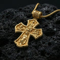 Load image into Gallery viewer, Holy Trinity cross pendant on volcanic stone showing a bright gold plated look that emphasizes the raised icons and borders.