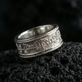 Load image into Gallery viewer, 925 silver vintage scroll band on black volcanic stone, polished silver rims framing the detailed floral curls and border lines.