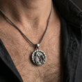 Load image into Gallery viewer, Sterling silver Freya goddess medallion pendant necklace worn on the neck, close-up lifestyle shot highlighting the oxidized finish and Norse relief details