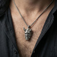 Load image into Gallery viewer, Sterling silver oni mask pendant necklace worn on the neck, close-up lifestyle shot highlighting the oxidized finish and horned demon face relief