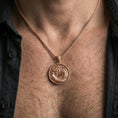Load image into Gallery viewer, Rose gold plated oriental dragon medallion pendant necklace worn on the neck, lifestyle wear shot with elegant rosy shine and crisp Eastern dragon texture visible.