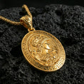 Load image into Gallery viewer, Gold plated Athena coin pendant necklace on textured volcanic rock, premium close-up with warm reflective shine across the helmet details, raised border, and Greek meander frame.