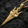 Load image into Gallery viewer, Gold plated Gungnir spear pendant necklace on textured volcanic rock, premium close-up with warm reflective shine across the spearhead contours and intricate Norse-inspired detailing.