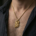 Load image into Gallery viewer, Gold plated Freyr and Gullinbursti pendant necklace worn on the neck, lifestyle photo featuring warm tone finish and strong statement Viking amulet presence.