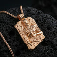 Load image into Gallery viewer, Rose gold plated Thor pendant necklace on textured volcanic rock, centered studio-style close-up showcasing soft rosy glow and intricate Viking knotwork with clear rune accents.