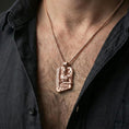 Load image into Gallery viewer, Rose gold plated Thor pendant necklace worn on the neck, lifestyle wear shot with elegant rosy shine and crisp rune-and-hammer detailing visible.
